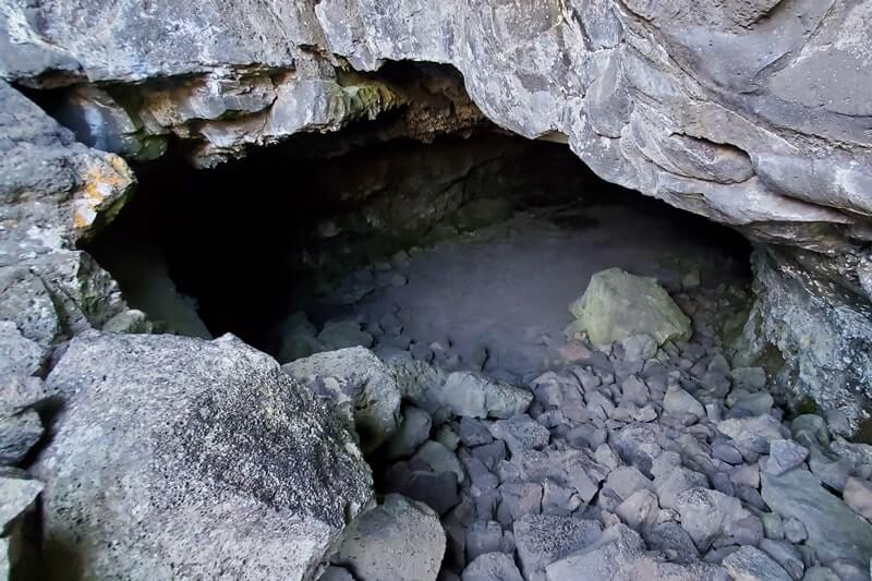 cave entrance of beauty cave lava tube. craters of the moon. idaho travel blog