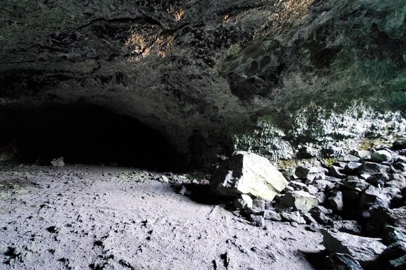 walking through beauty cave lava tube. craters of the moon. idaho travel blog