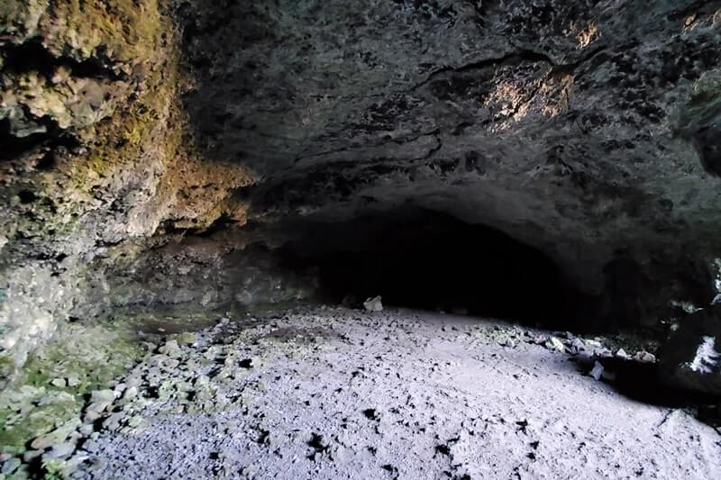 walking through beauty cave lava tube. craters of the moon. idaho travel blog