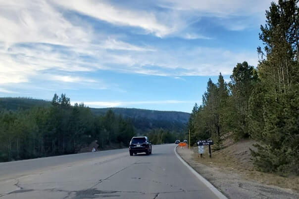 Road to Black Sand Basin in Yellowstone National Park. wyoming travel blog