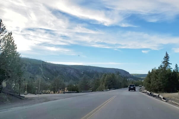 Road to Black Sand Basin in Yellowstone National Park. wyoming travel blog