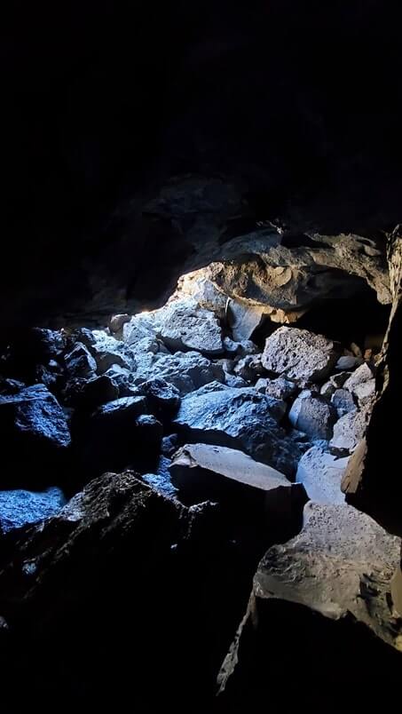 Inside Boy Scout Cave: Where to see a lava tube in Idaho. Craters of the moon lava tube. Craters of the moon caves in Idaho. idaho travel blog