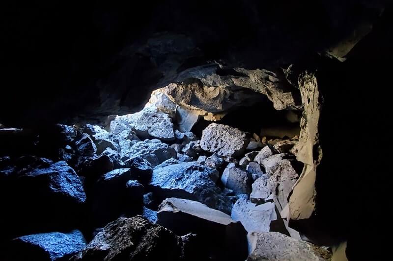 Inside Boy Scout Cave: Where to see a lava tube in Idaho. Craters of the moon lava tube. Craters of the moon caves in Idaho. idaho travel blog