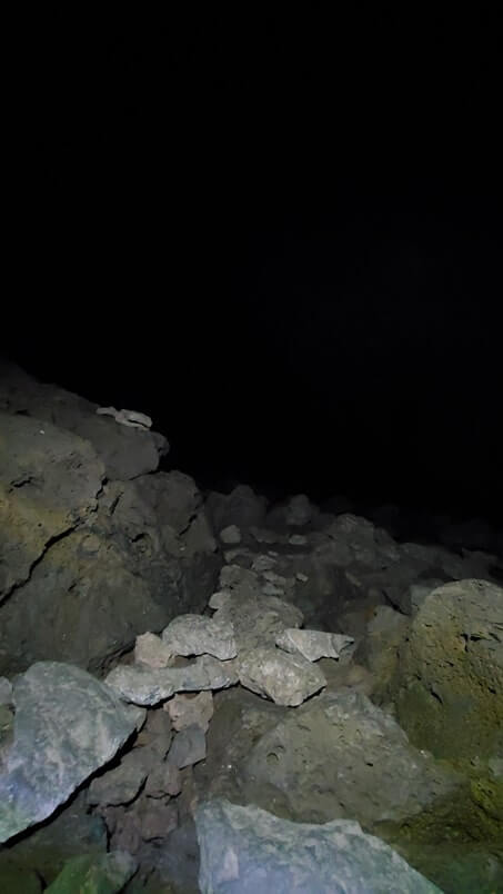 walking through boy scout cave lava tube. craters of the moon. idaho travel blog