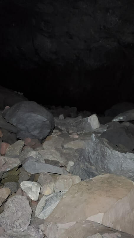 walking through boy scout cave lava tube. craters of the moon. idaho travel blog