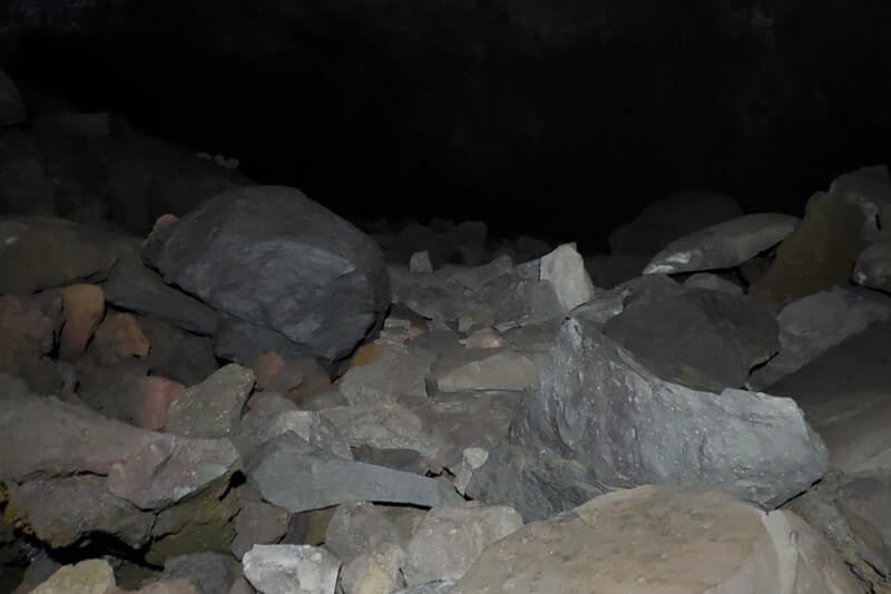 walking through boy scout cave lava tube. craters of the moon. idaho travel blog