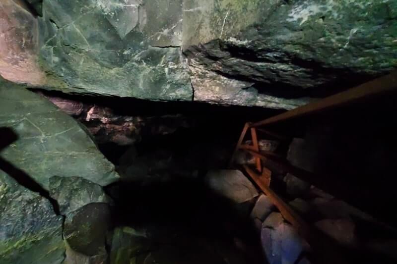 going into boy scout cave lava tube. craters of the moon. idaho travel blog