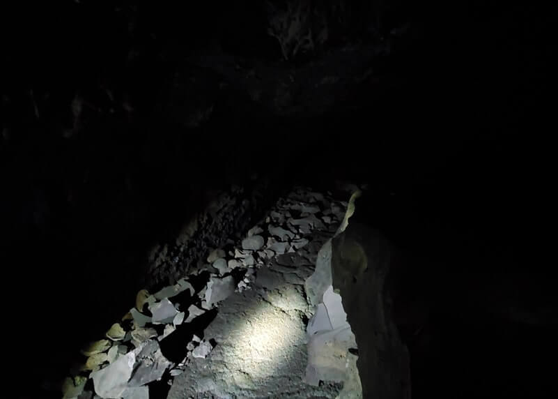 walking through boy scout cave lava tube. craters of the moon. idaho travel blog