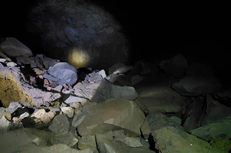 walking through boy scout cave lava tube. craters of the moon. idaho travel blog