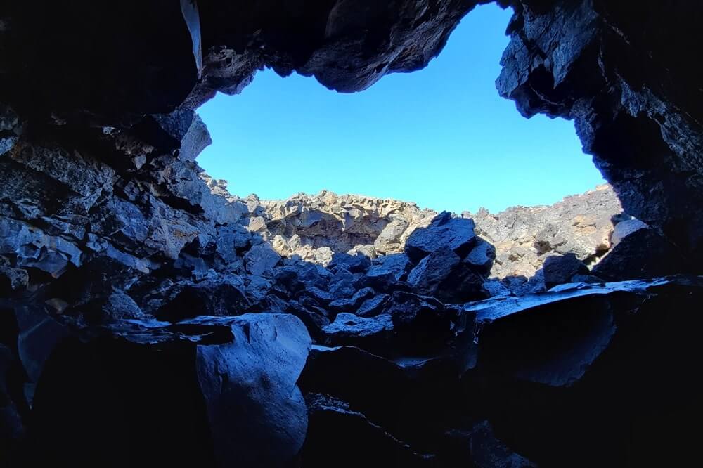 Dewdrop Cave: Where to see a lava tube in Idaho. Craters of the moon lava tube. Craters of the moon caves in Idaho. idaho travel blog