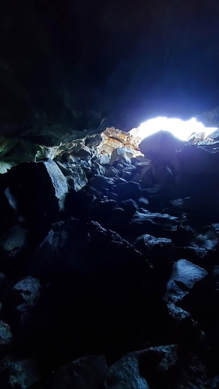 Dewdrop Cave: Where to see a lava tube in Idaho. Craters of the moon lava tube. Craters of the moon caves in Idaho. idaho travel blog