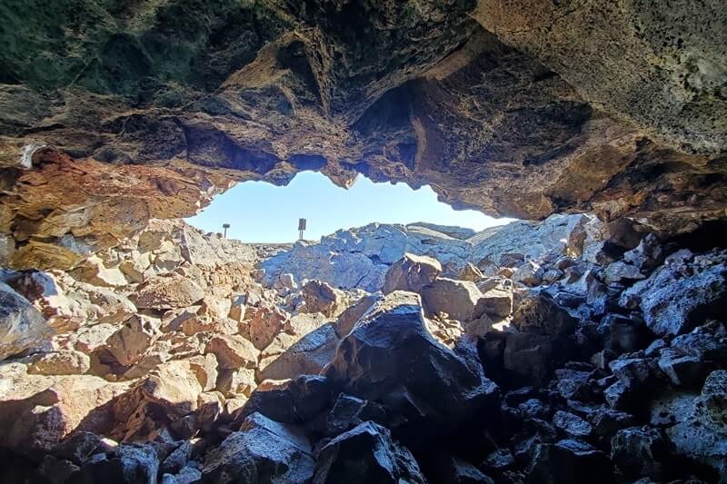 Dewdrop Cave: Where to see a lava tube in Idaho. Craters of the moon lava tube. Craters of the moon caves in Idaho. idaho travel blog