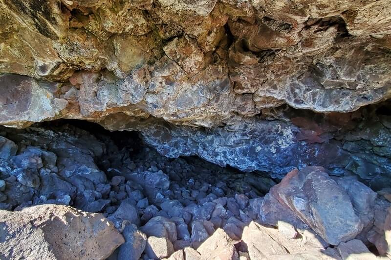 going into Dewdrop Cave. craters of the moon. idaho travel blog