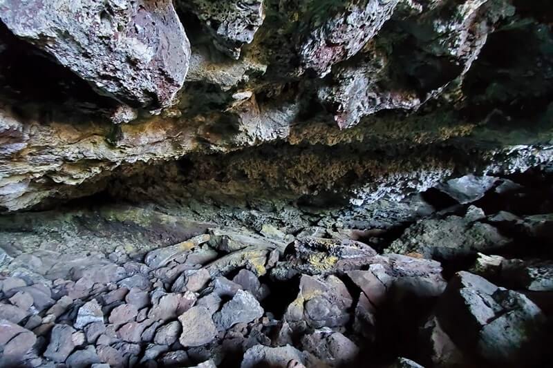 going into Dewdrop Cave. craters of the moon. idaho travel blog