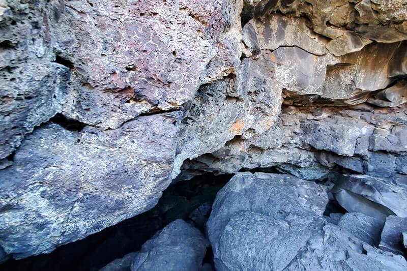 going into Dewdrop Cave. craters of the moon. idaho travel blog