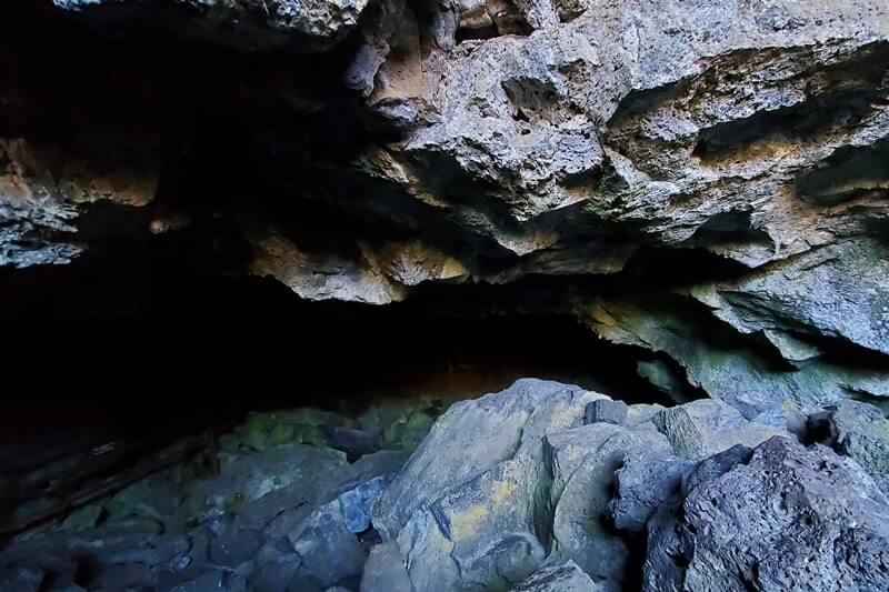 going into Dewdrop Cave. craters of the moon. idaho travel blog