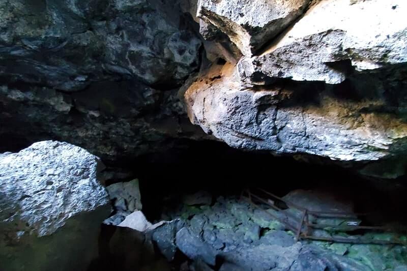going into Dewdrop Cave. craters of the moon. idaho travel blog