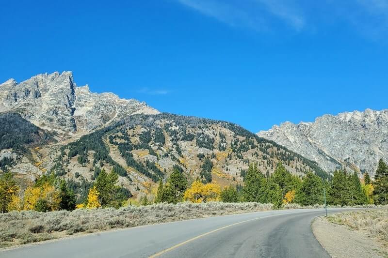 Driving the 42-mile scenic loop road in Grand Teton National Park: Driving through Grand Teton National Park to lupine meadows road. wyoming travel blog