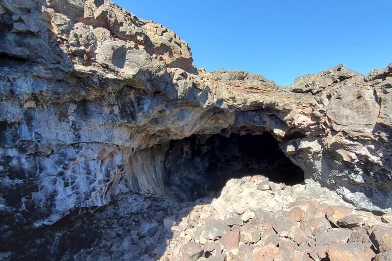 walking through indian tunnel lava tube. craters of the moon tunnel. idaho travel blog