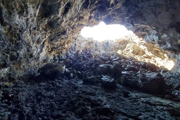 walking through indian tunnel lava tube. craters of the moon tunnel. idaho travel blog