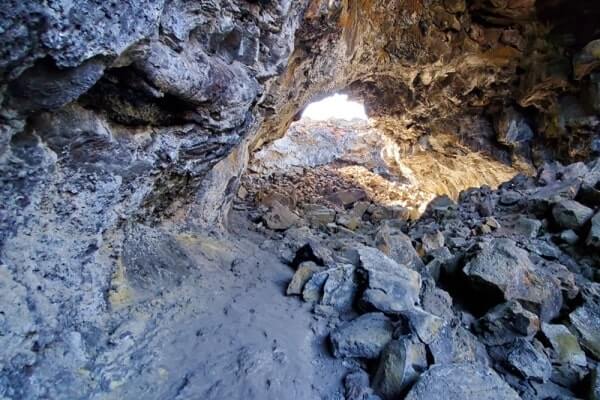walking through indian tunnel lava tube. craters of the moon tunnel. idaho travel blog