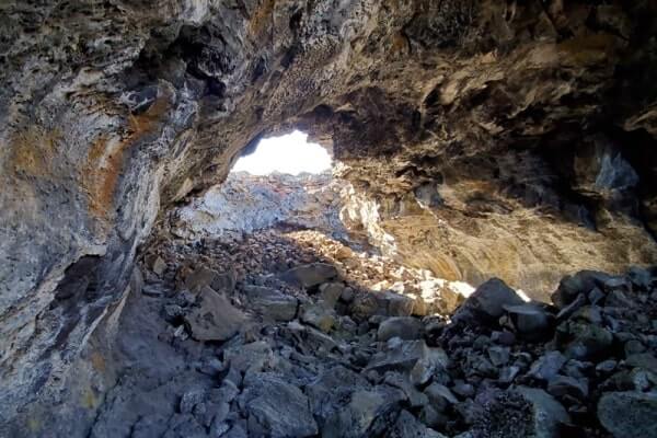 walking through indian tunnel lava tube. craters of the moon tunnel. idaho travel blog