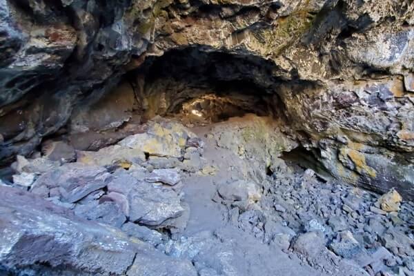 walking through indian tunnel lava tube. craters of the moon tunnel. idaho travel blog