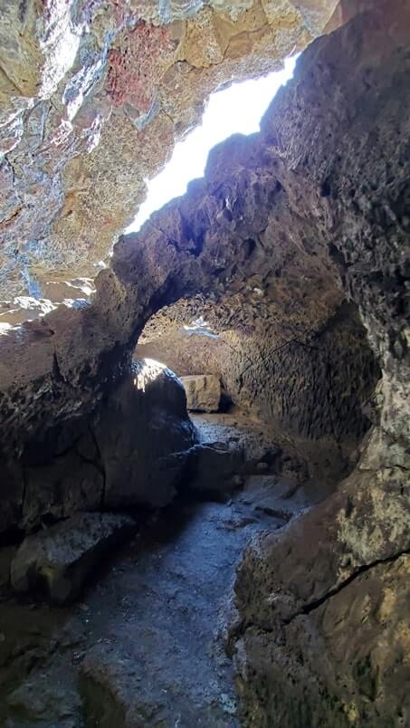 walking through indian tunnel lava tube. craters of the moon tunnel. idaho travel blog