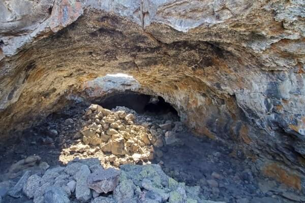 walking through indian tunnel lava tube. craters of the moon tunnel. idaho travel blog