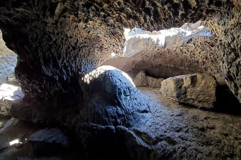walking through indian tunnel lava tube. craters of the moon tunnel. idaho travel blog