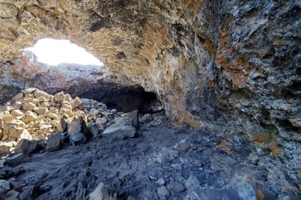 walking through indian tunnel lava tube. craters of the moon tunnel. idaho travel blog