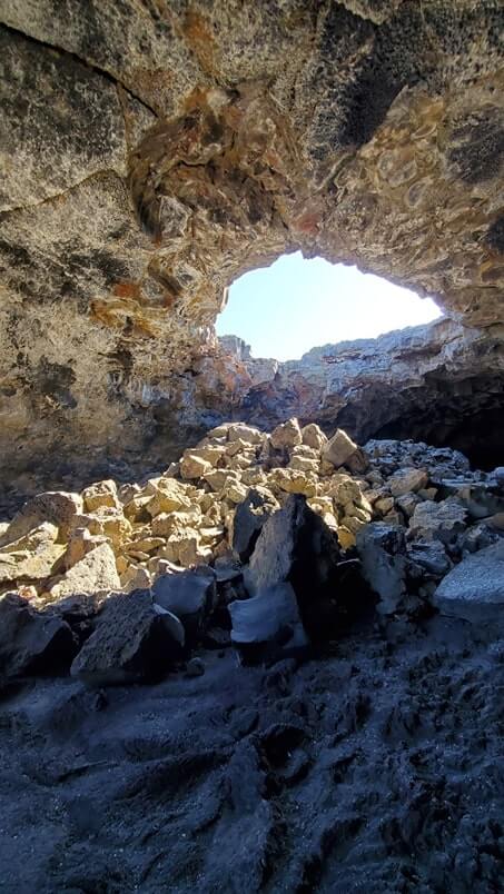walking through indian tunnel lava tube. craters of the moon tunnel. idaho travel blog