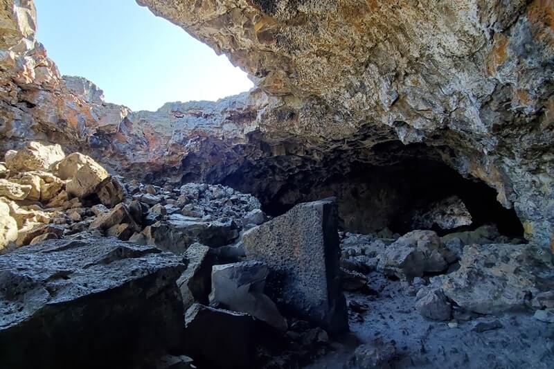 walking through indian tunnel lava tube. craters of the moon tunnel. idaho travel blog