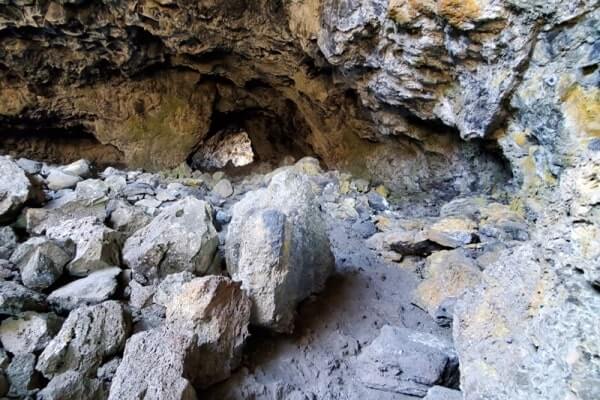 walking through indian tunnel lava tube. craters of the moon tunnel. idaho travel blog