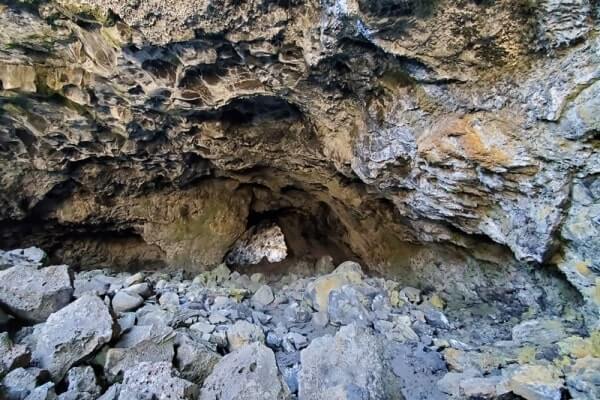 walking through indian tunnel lava tube. craters of the moon tunnel. idaho travel blog
