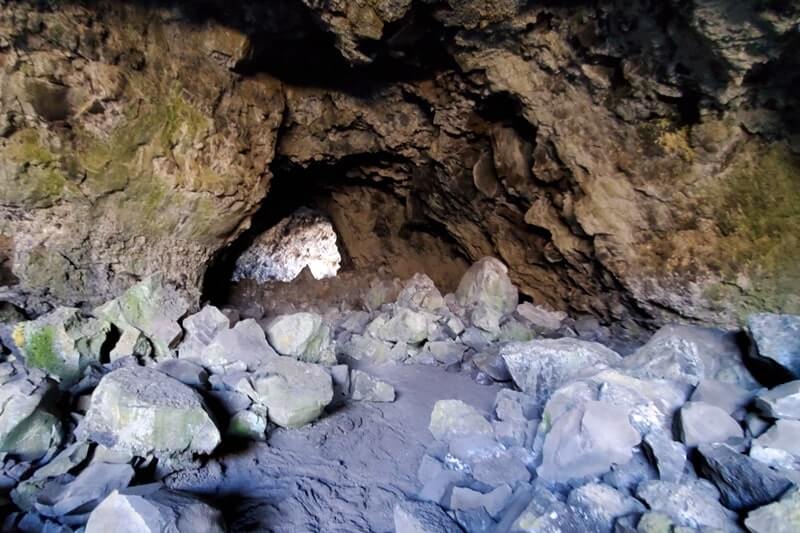 walking through indian tunnel lava tube. craters of the moon tunnel. idaho travel blog