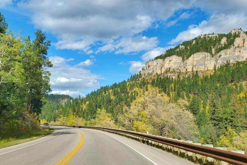 Driving from Mount Rushmore to Devils Tower: Driving through Spearfish Canyon scenic byway in South Dakota. South Dakota to Wyoming road trip.