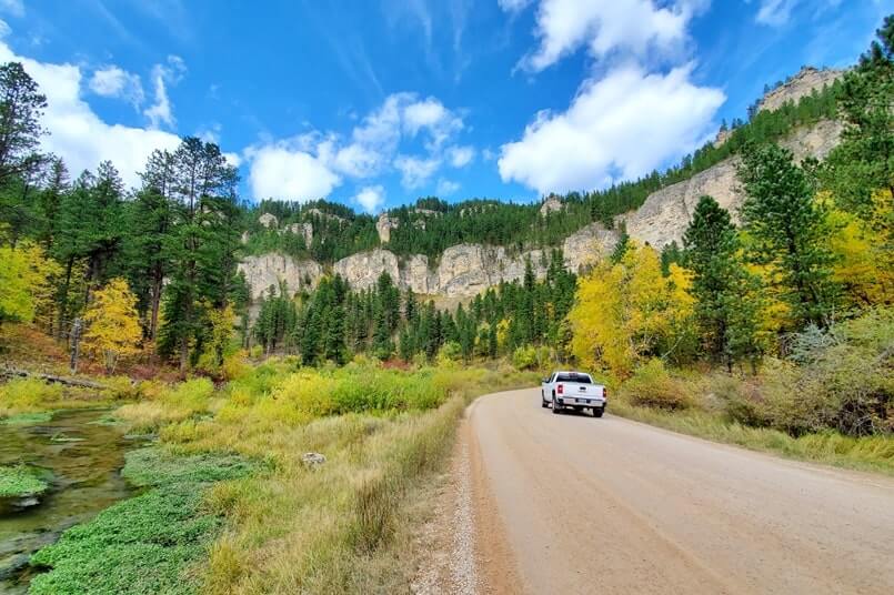Stops to make when driving from Mount Rushmore to Roughlock Falls to Devils Tower: roughlock falls road. south dakota to wyoming