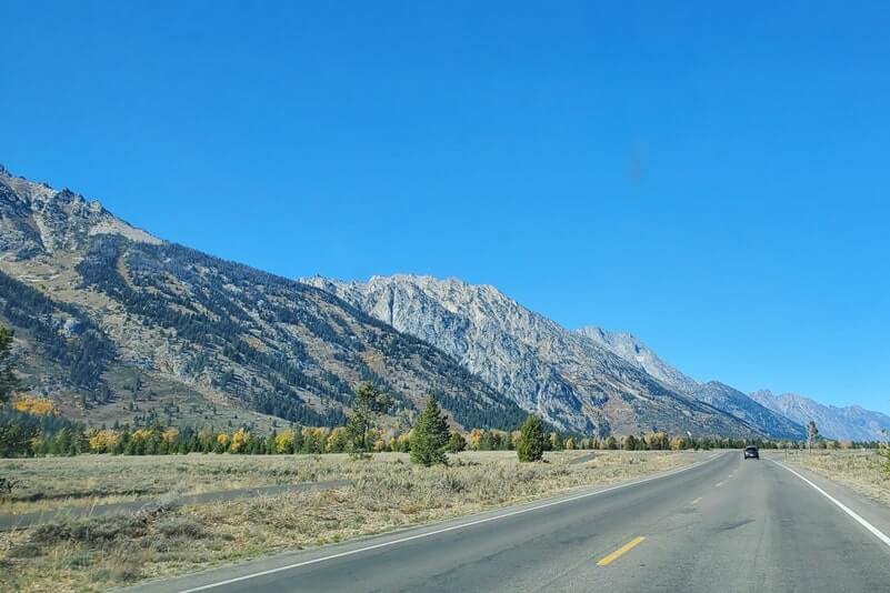 driving the teton park road to cascade canyon turnout. grand teton scenic loop drive. wyoming travel blog