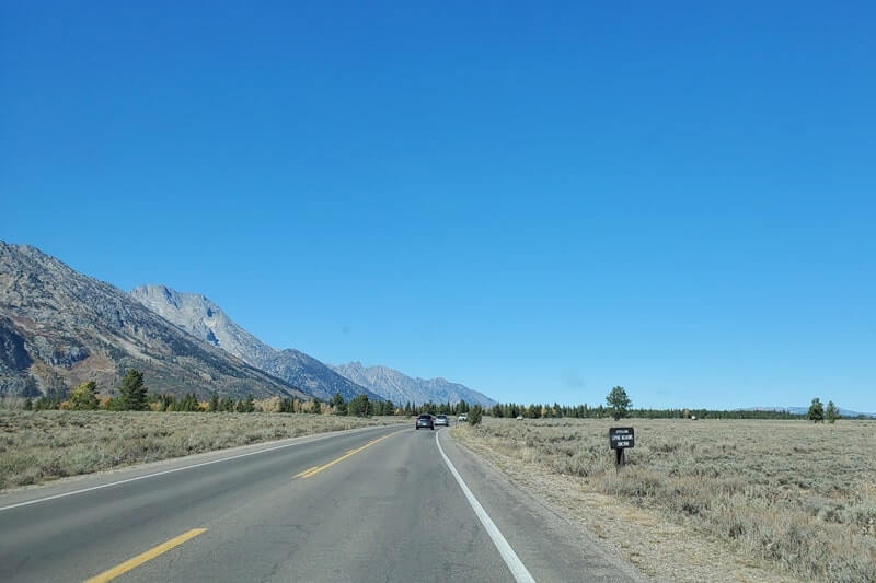 driving the teton park road to cascade canyon turnout. grand teton scenic loop drive. wyoming travel blog