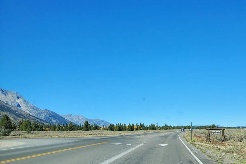 driving the teton park road to cascade canyon turnout. grand teton scenic loop drive. wyoming travel blog