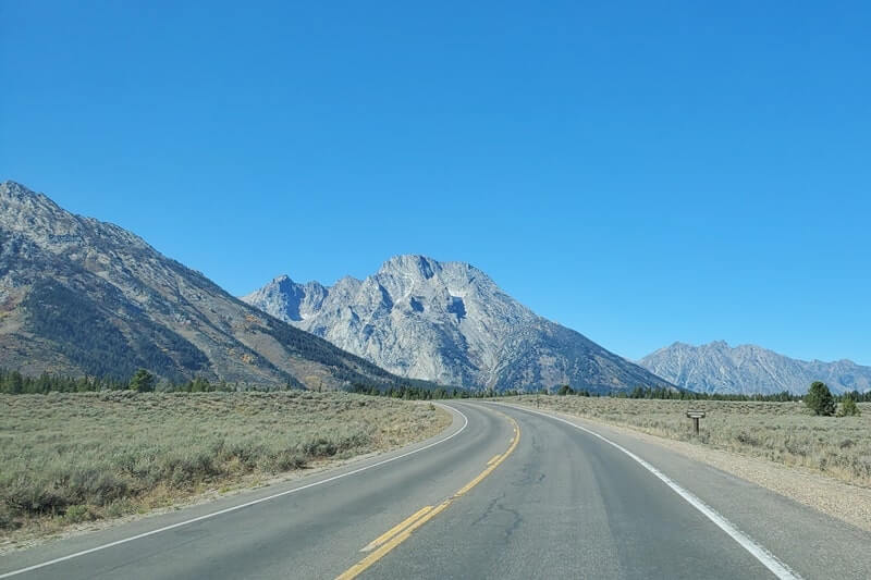 driving the teton park road to cascade canyon turnout. grand teton scenic loop drive. wyoming travel blog