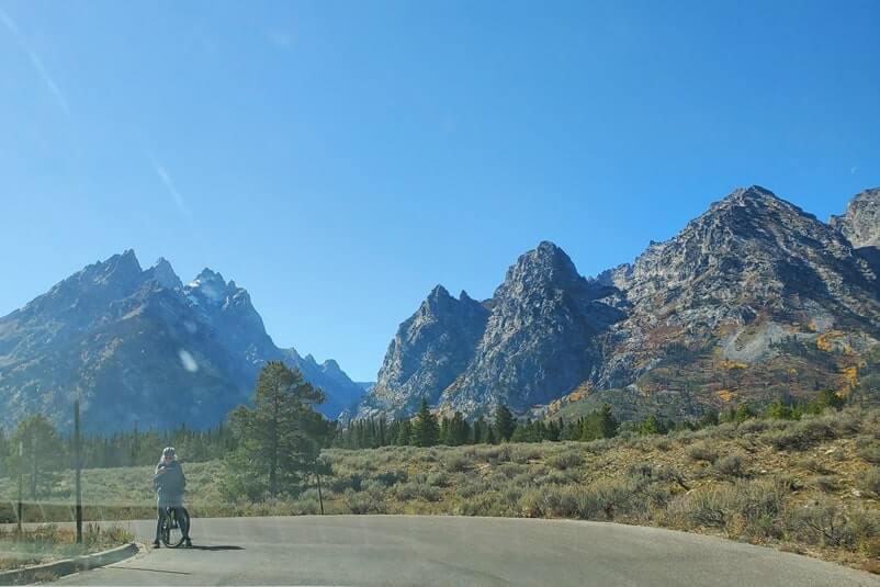 biking the teton park road to cascade canyon turnout. grand teton scenic loop drive. wyoming travel blog