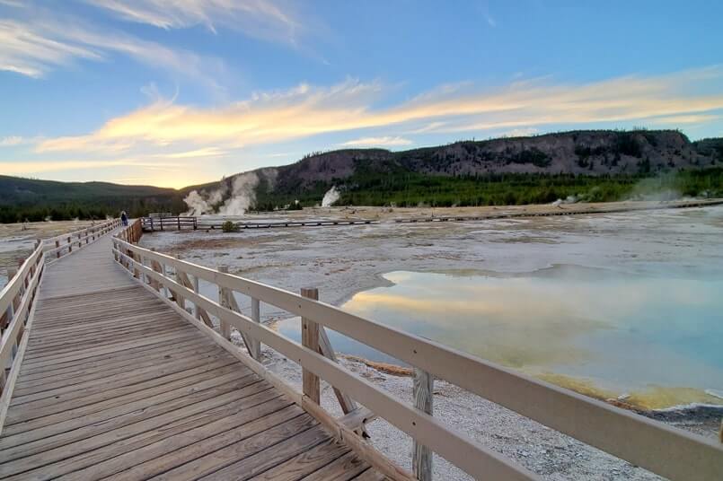 trail around sapphire pool: bright blue yellowstone hot spring in biscuit basin. wyoming travel blog