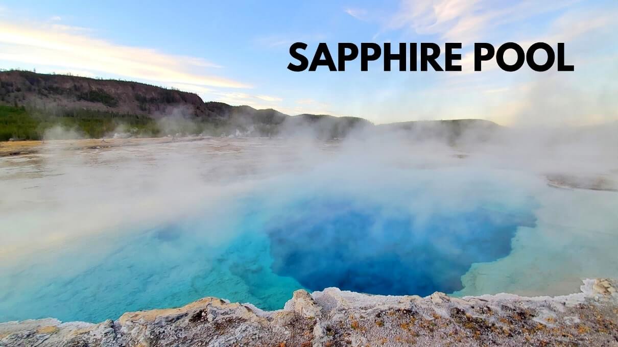 colorful hot spring in biscuit basin near old faithful: sapphire pool in yellowstone national park. wyoming travel blog