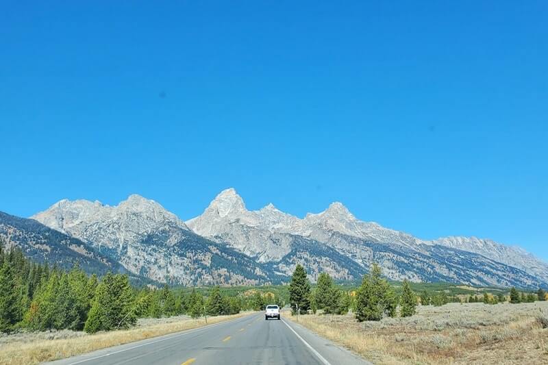 driving to Teton Glacier turnout on teton park road in grand teton national park. grand teton scenic loop drive. wyoming travel blog