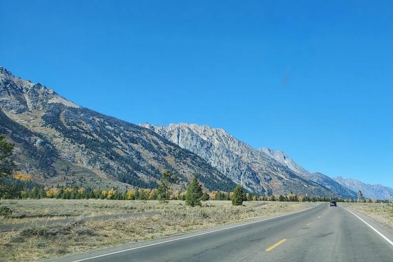 driving teton park road from teton glacier turnout. grand teton scenic loop drive. wyoming travel bra