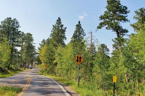 Driving iron mountain road to cc gideon tunnel, black hills national forest. south dakota travel blog