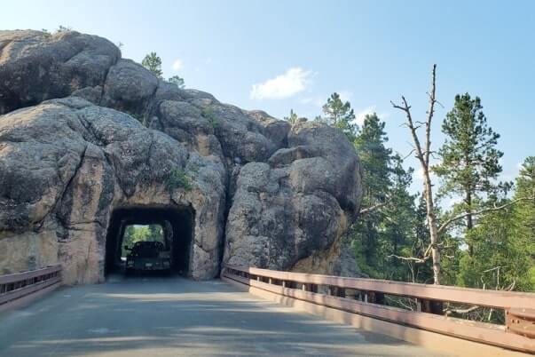 Driving through cc gideon tunnel. iron mountain road tunnel. black hills national forest. south dakota travel blog