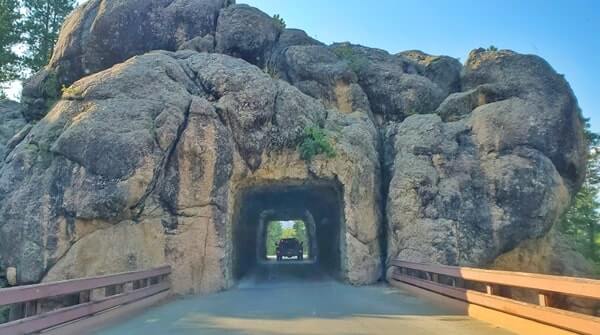 Driving through cc gideon tunnel. iron mountain road tunnel. black hills national forest. south dakota travel blog